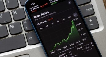 Dow Jones hits record high with Home Depot, while Nasdaq falls with chip pressure